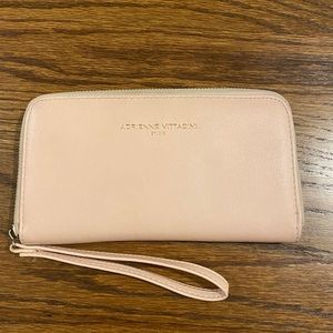 Light pink wallet with built in charger